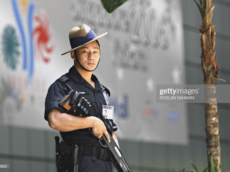 Singapore Gurkha Police with his official service kukri