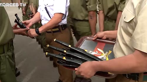 Ceremonial kukris being given after passing out basic training