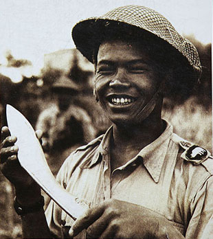 Gurkha soldier showing khukuri with smiles 