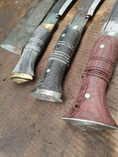 different butt caps of kukri handle